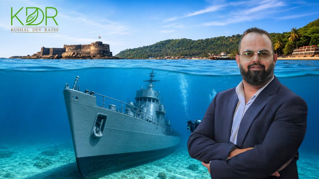 A cinematic aerial view of INS Guldar resting beneath the clear blue waters off Sindhudurg's coastline, showcasing marine tourism, underwater exploration, vibrant marine life, and the scenic Konkan coast with coastal infrastructure and tourism development in the background.